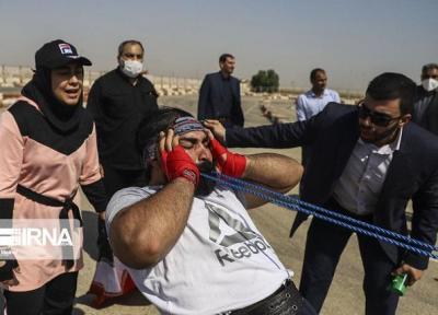 ثبت رکورد جهانی جابه جایی کامیون با دندان توسط 2 خوزستانی